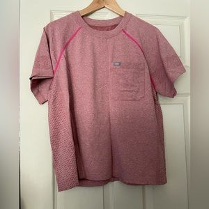 Figs under scrub shirt